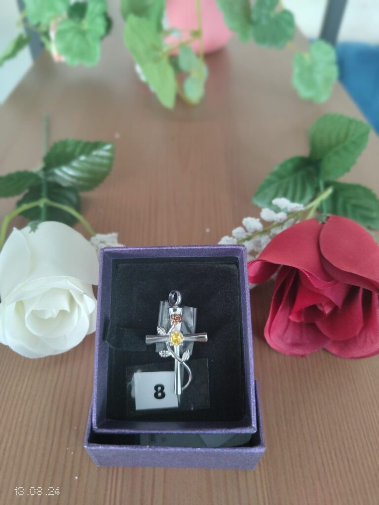 8 CROSS WITH YELLOW STONE AND GOLD FLOWER